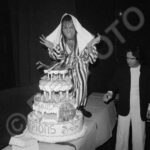 Scorpions, France Tour Mar ’82, © 1982 Robert EllisRepfoto… Matthias takes a bite out of the scorpion on top of the backstage celebratory cake from Albert Koski the promoter.